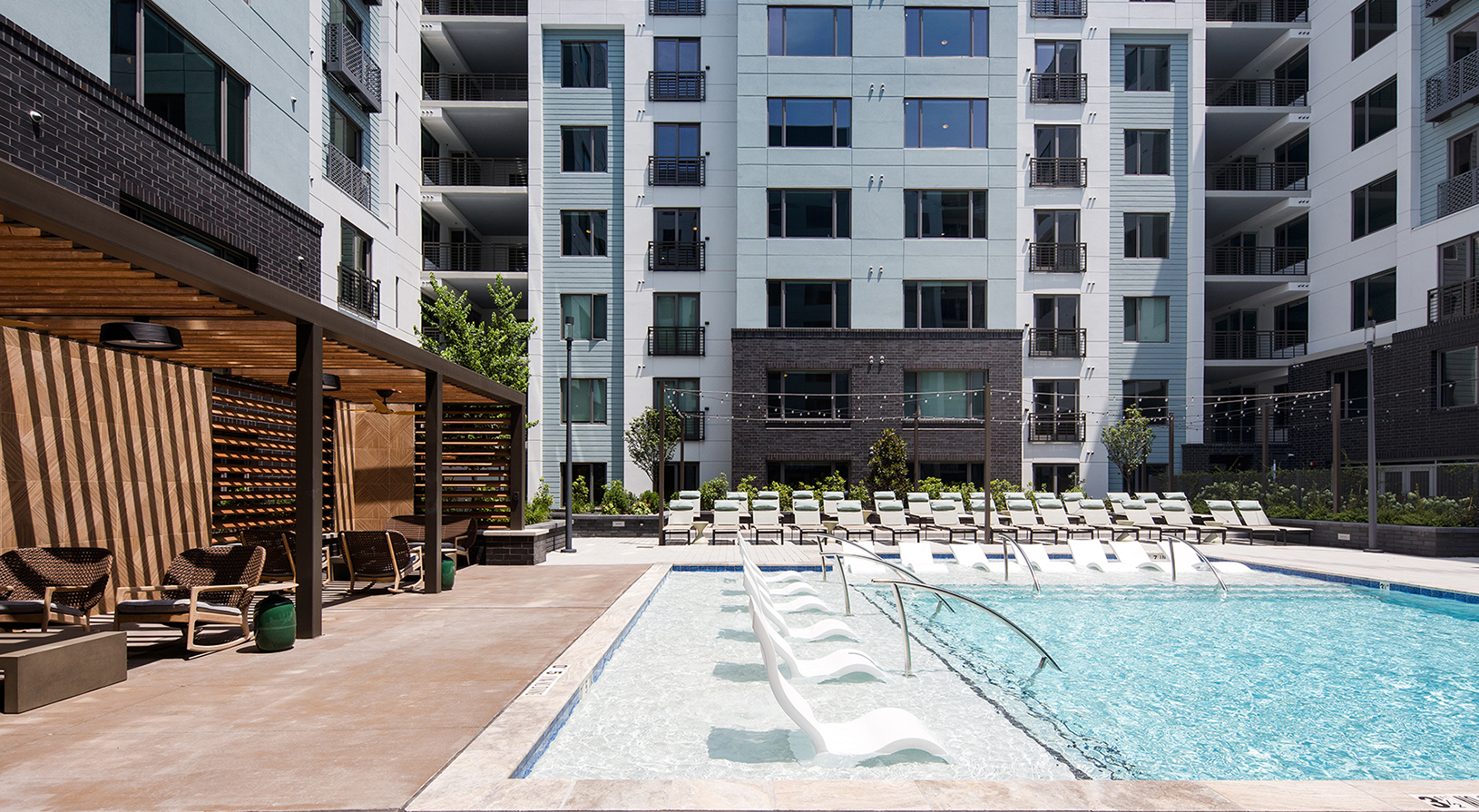 Peace Raleigh Apartments pool - view of the in-pool lounge chair seating available