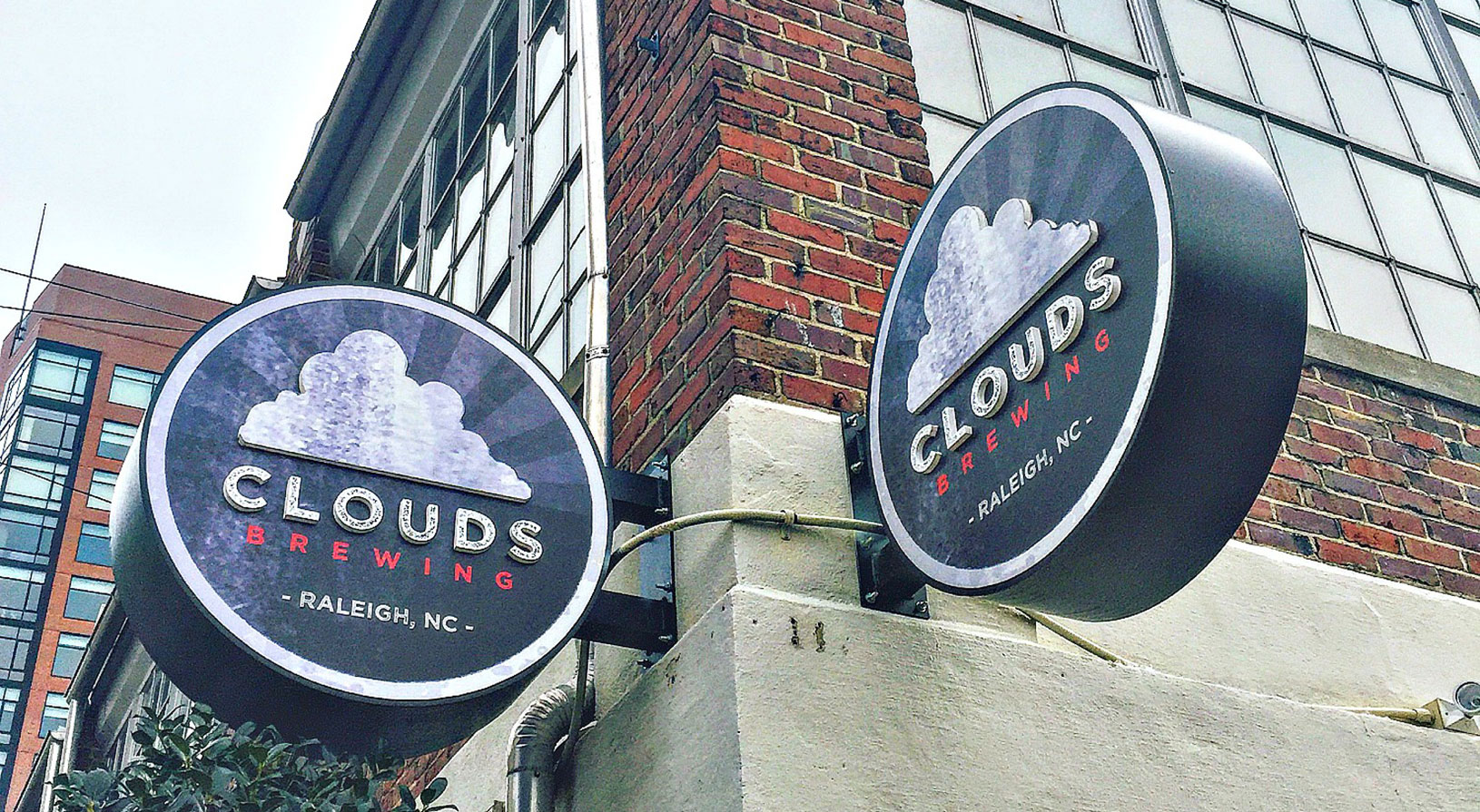 Peace Raleigh Apartments Clouds brewing logo exterior signage
