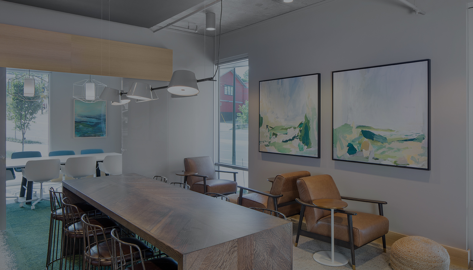 Peace Raleigh Apartments business center with large framed art decor and multiple seating options